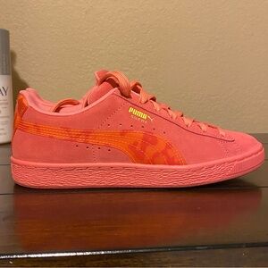 Pink suede pumas